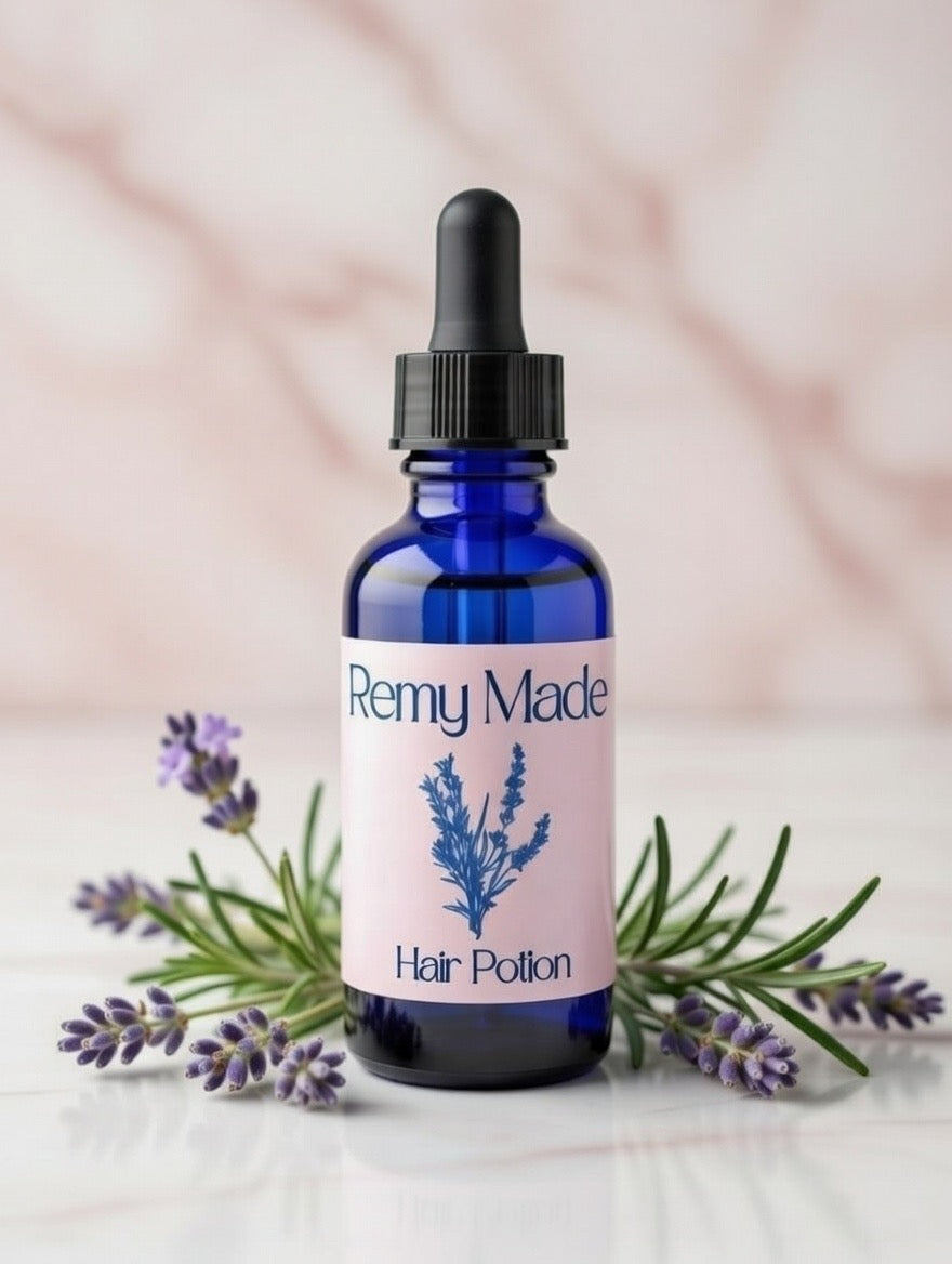 Remy Made Hair Potion on blush marble surface with lavender